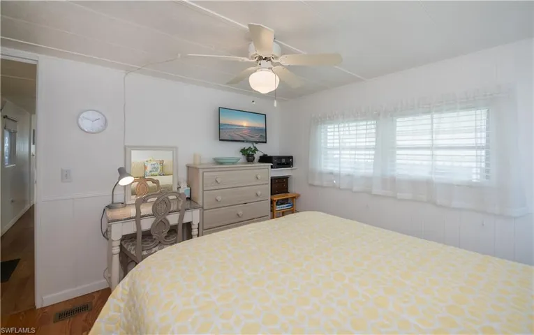 Bedroom featuring wood-type flooring and ceiling fan