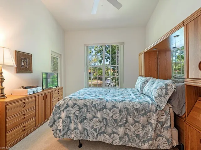 Bedroom with carpet floors and a ceiling fan
