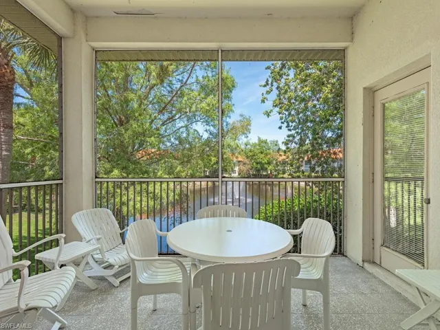 Sunroom / solarium featuring outdoor dining space, a water view, and a healthy amount of sunlight