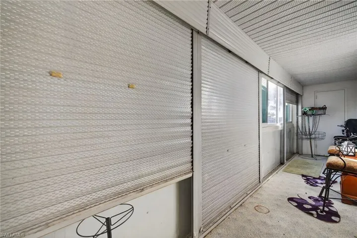 Hallway featuring unfinished concrete flooring