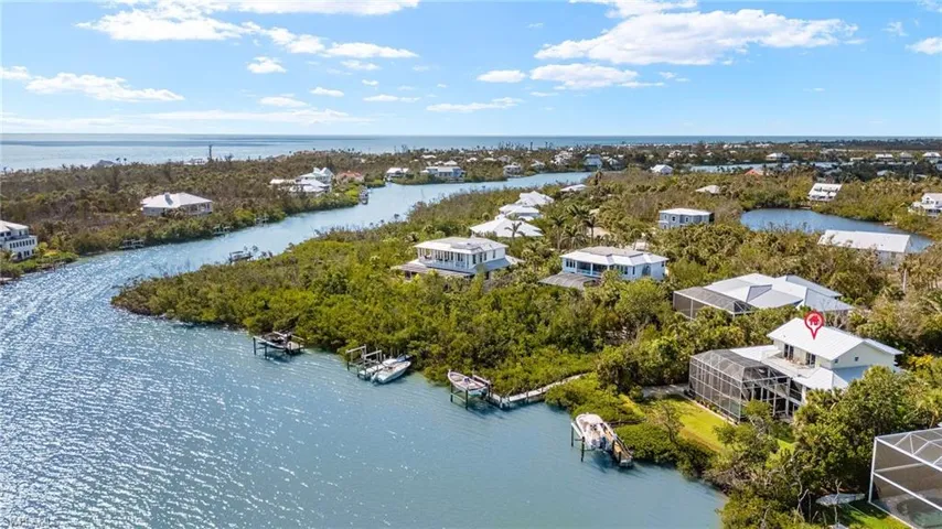 Aerial view of residential area with a large body of water