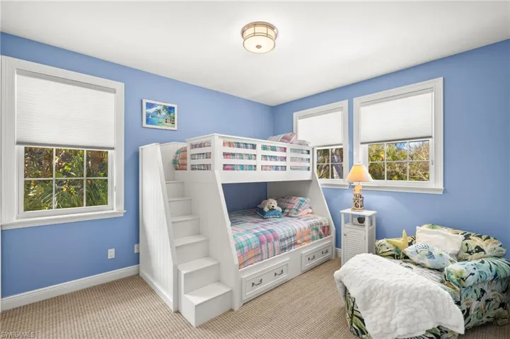 Carpeted bedroom with baseboards