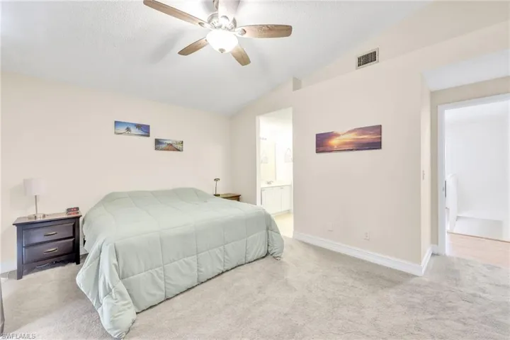 Primary Bedroom features  carpet floors, ceiling fan