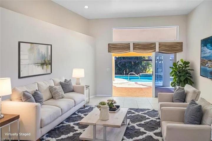 *VIRTUALLY STAGED* Living room with tile patterned flooring and recessed lighting