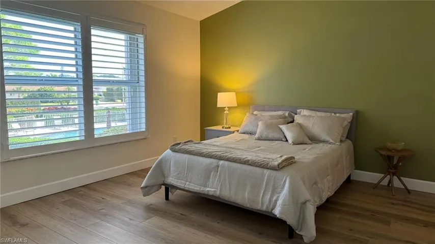 Master Bedroom with hardwood / wood-style floors