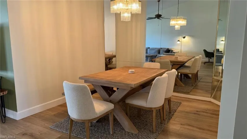 Dining space featuring ceiling fan and light hardwood / wood-style floors