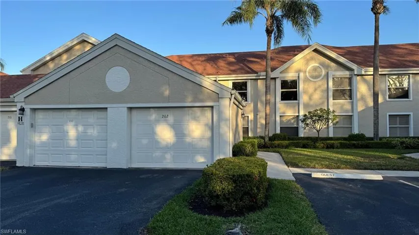 View of front of building featuring a garage