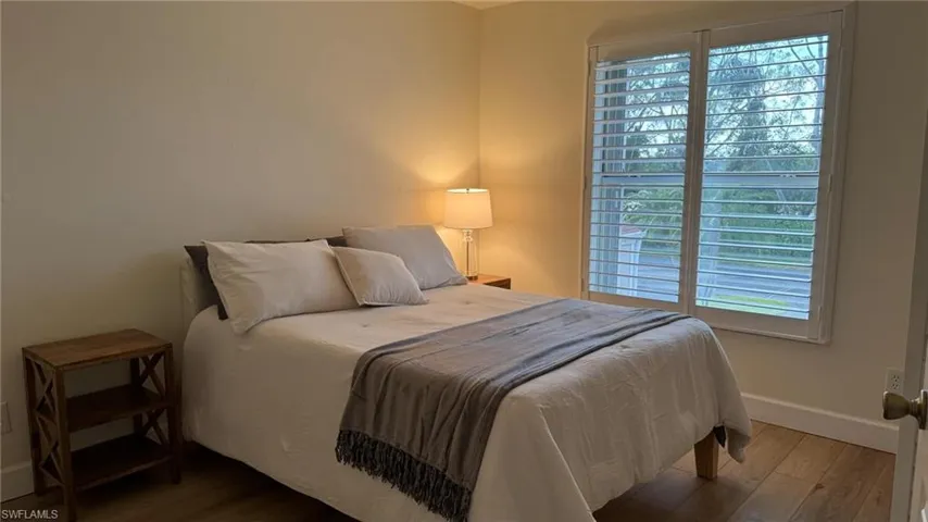 Guest Bedroom featuring hardwood / wood-style flooring