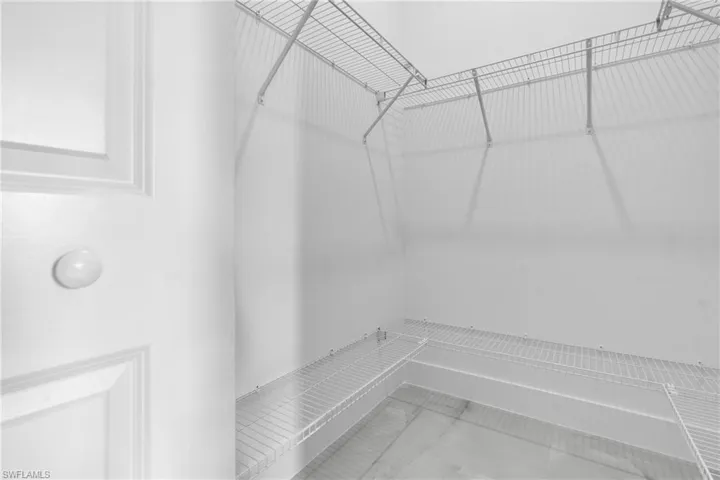 Spacious closet with marble finish floors