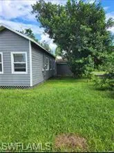 View of home's exterior featuring a lawn