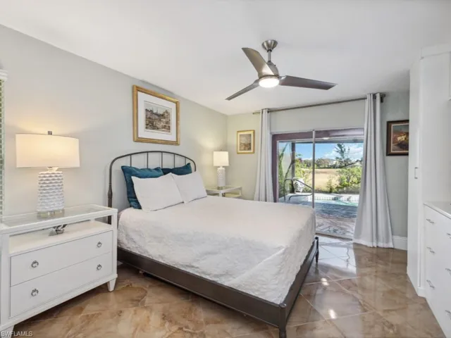Bedroom featuring access to exterior and ceiling fan