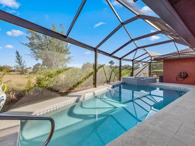 View of pool with a lanai