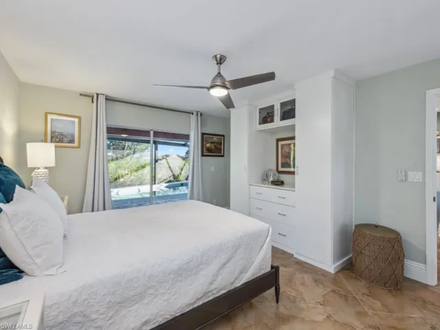 Bedroom with access to exterior and ceiling fan