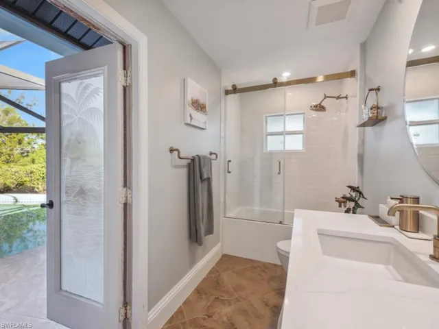 Bathroom with plenty of natural light, toilet, and vanity