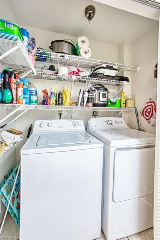 Laundry room featuring separate washer and dryer