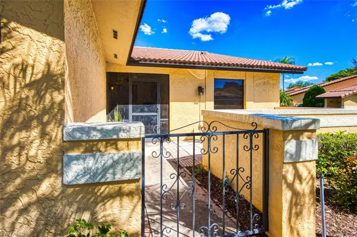 Gate featuring a fenced front yard