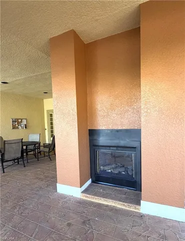 Large covered sitting area at the clubhouse with outdoor fireplace