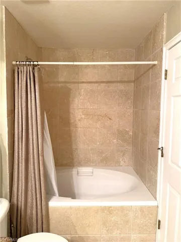 Tiled shower and round tub combination