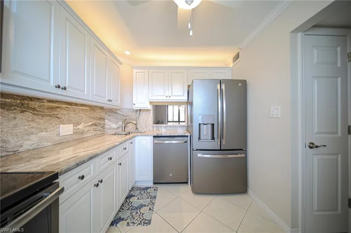 This Updated Kitchen Features Stainless Steel Appliances, Granite Countertops And Backsplash, White Wooden Cabinets & Drawers, A Large Pantry, A Passthrough To The Dining Room, And Lots Of Natural Lighting!