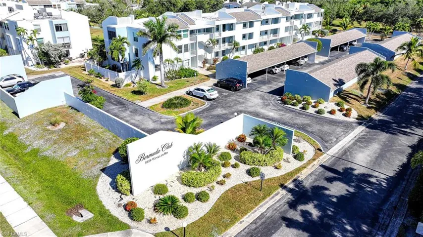 Aerial View Of Complex Entry, Parking, And Building!