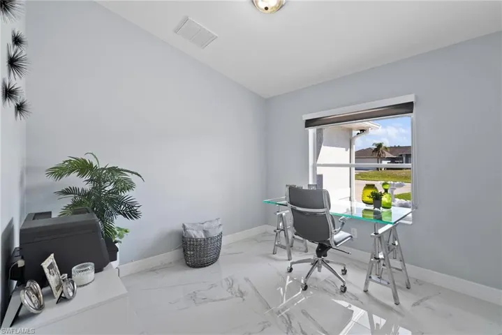 Office featuring marble finish floors and baseboards