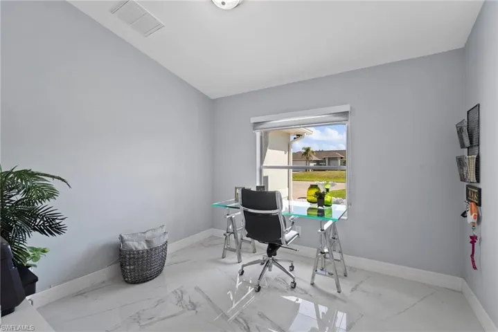 Office space with marble look tile flooring