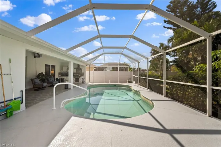 Swimming pool with a patio and a lanai