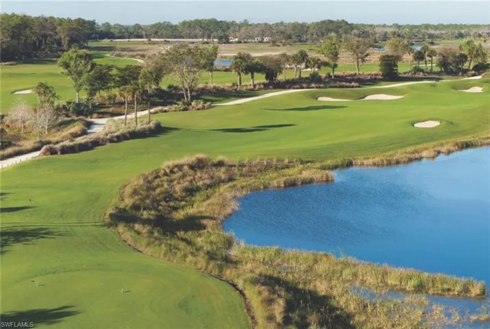 View of property's community featuring view of golf course, a water view, and view of wooded area