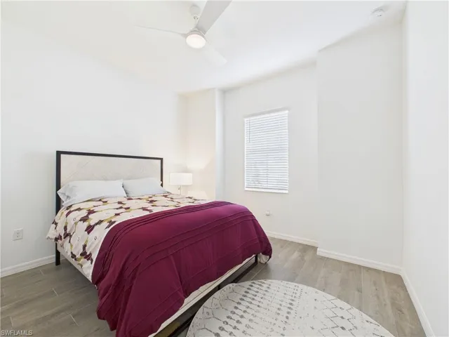 Bedroom featuring wood finished floors and ceiling fan