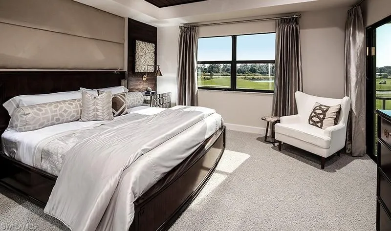Carpeted bedroom featuring baseboards