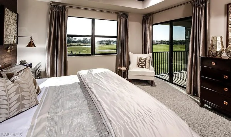 Carpeted bedroom featuring access to outside