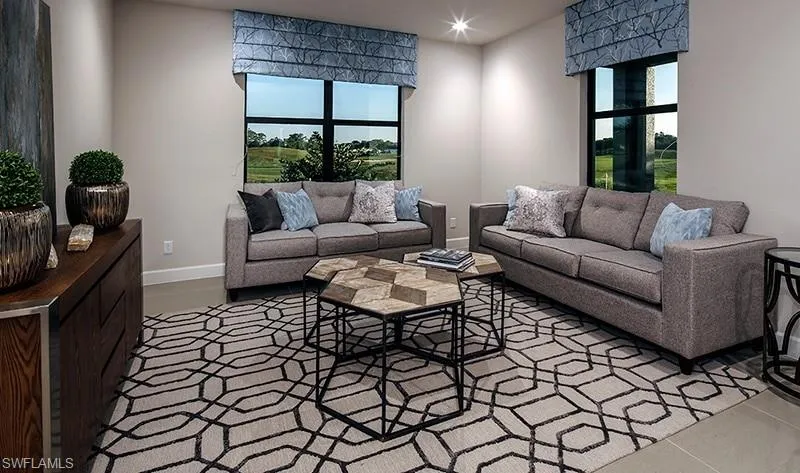 Living room with baseboards and recessed lighting