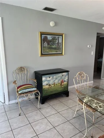 Living area featuring light tile patterned flooring