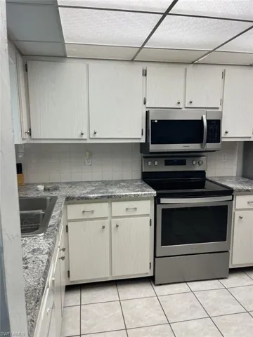 Kitchen featuring newer stainless steel appliances