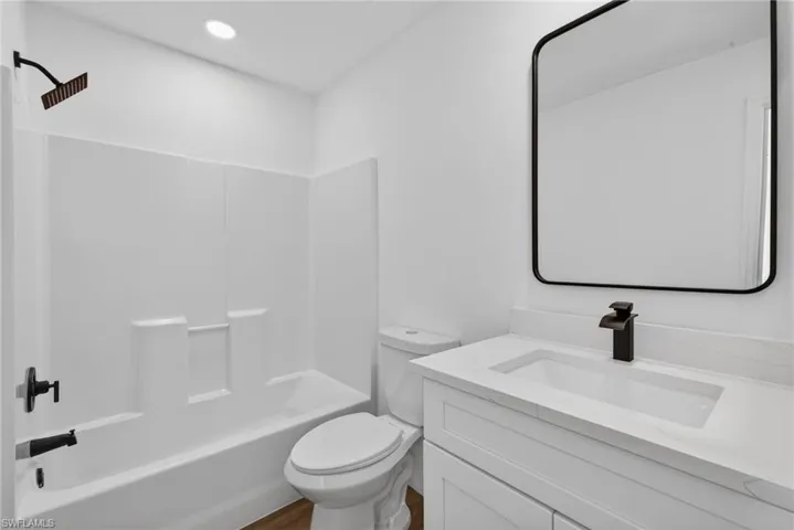Primary Bathroom with Shaker Vanity, Quartz, Maintenance Free Shower