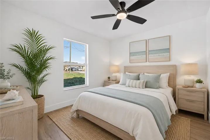 Guest Bed with New Wide Plank Vinyl Floors and a Modern Fan