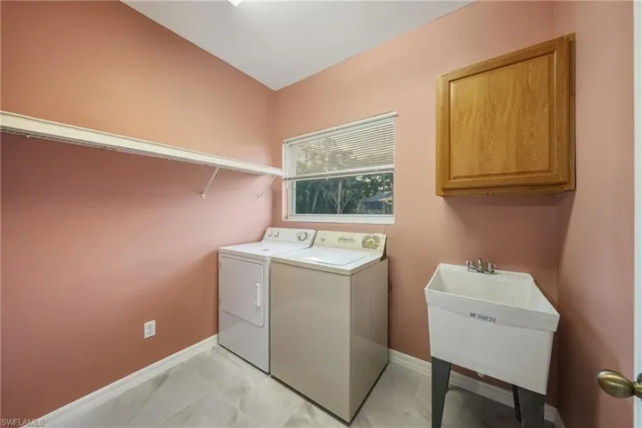 Laundry room with cabinet space and washer and dryer