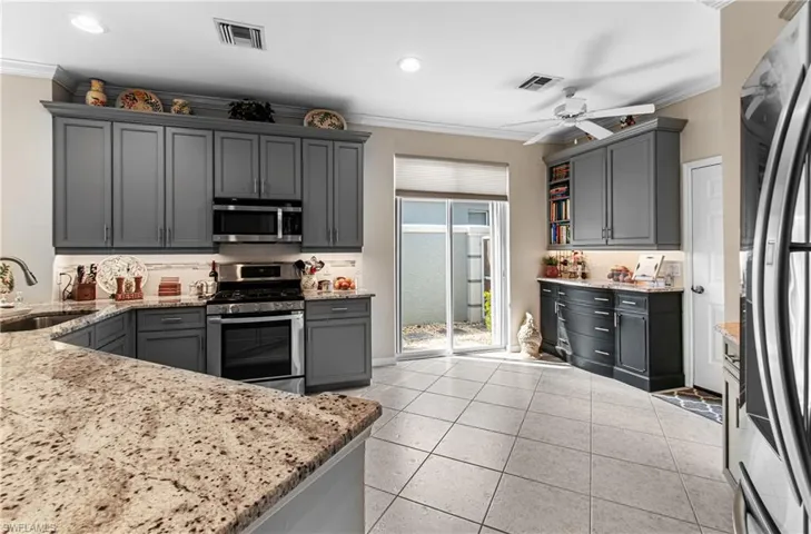 NOTE THE SET OF CABINETS & COUNTERTOP TO THE RIGHT OF THE DOORWAY. THESE HAVE BEEN ADDED IN. OTHER HOMES WILL NOT HAVE THIS SPECIAL FEATURE!