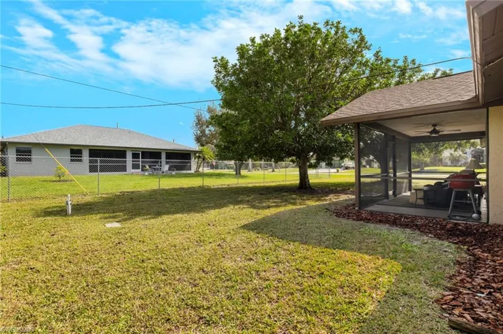 This property boasts a large corner lot, offering ample space for a refreshing pool.