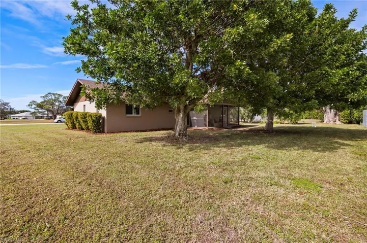 This property boasts a large corner lot, offering ample space for a refreshing pool.