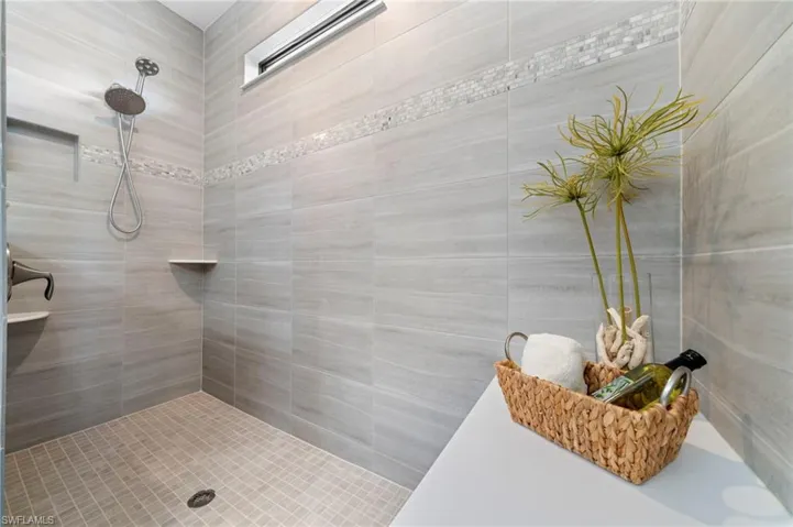 Full bathroom with a tile shower