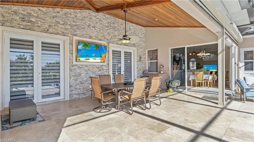 Five access points to the outside - the  master bedroom, living room, 90 degree sliders from the kitchen, a pool bath and last but not least the rear guest room!