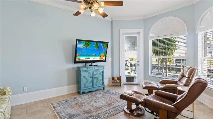 One of the fun parts about this VERY flexible floor plan!  This is currently used as a tv room / retreat.  It features private acces on the side of the home to the outdoors!  Would be a perfect setup also for someone who works from a home office!  Double door entry way, lots of light and those incredible views!