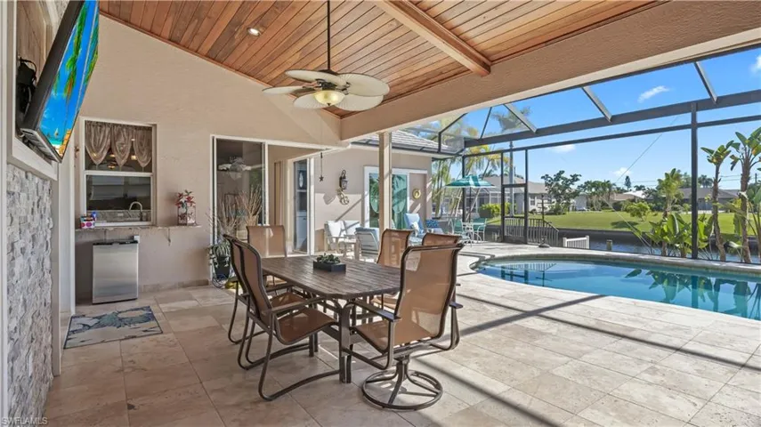 why live indoors when you can eat dinner outside everynight?  Screened lanai  with 90 degree sliders that can be opened to the exterior and expand your living space!
