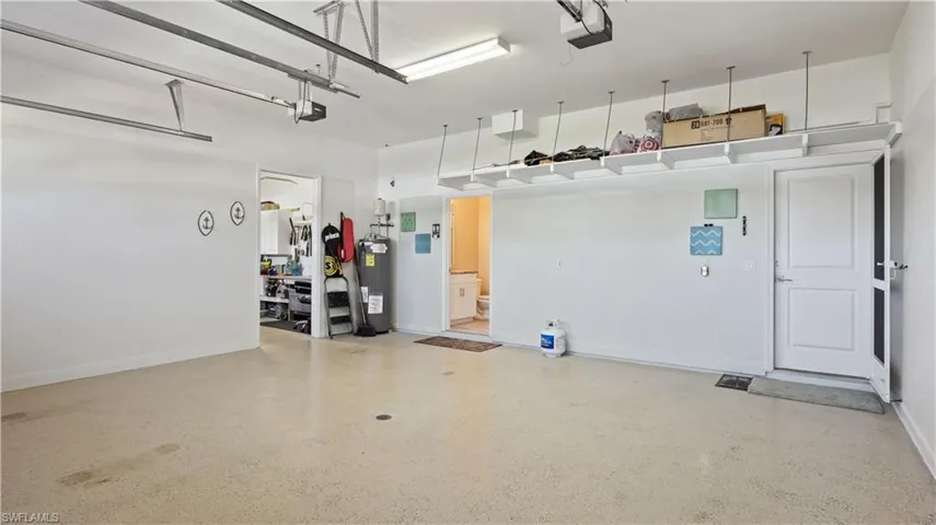 Deep 2 of 3 stall garage - this has its own private  bathroom and entry into the third separate garage bay that is set up as  the perfect workshop!