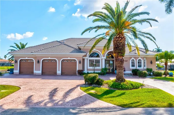 WELCOME to PARADISE!  Everything about this home is perfect - the location at the end of a culdesac, on the corner of intersecting canals, southern exposure and extended paved driveway with plenty room for parking multiple vehicles.  Lush and mature landscaping with beautiful brand new roof - this really has it all!