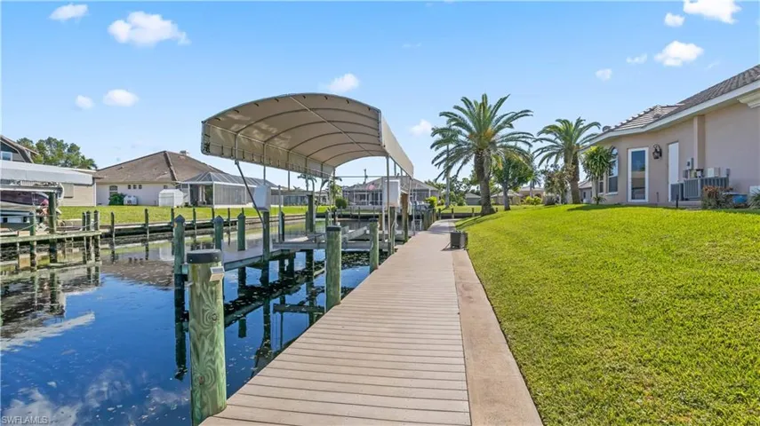 Over 275 feet of seawall!!!!  Extended Captain's walk!!!   Covered canopy and boatlift!