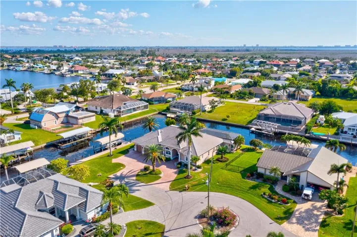 Do you like entertaining?  This home was built for entertaining and even the overized driveway is paved, extended and has tons of room for parking - a vibrant home from every aspect both inside and out!