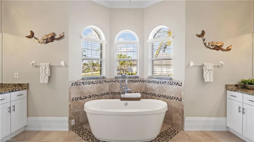 Soak all your troubles away in this deep soaking tub!  Large separate walk in shower and his and hers dual vanities!