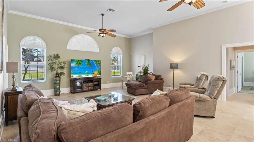 Oversized living room with plenty of seating for oversized furniture configurations!  There is a media room with double french doors directly off the living area that can be used as an additional living space, media room (current use), an additional bedroom, a gym or many other uses!